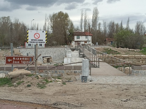 Kütahya, Türkiye – April 16, 2023: The water of Kocaçay, which was called Penkalas in ancient times, was cut off to remove the ruins of the ancient city of Aizanoi. In addition, two of the five bridges on the river were restored.