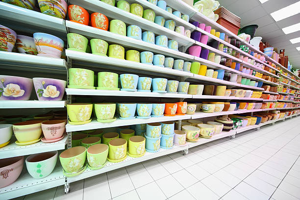 Shelves with variety colorful of clay flowerpot inside large supermarket
