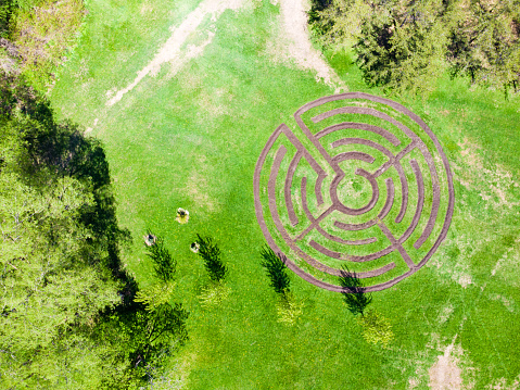 Aerial view of labyrinth made with soil, soon to be planted with flowers, in Domaine Maizerets, Quebec city, during day of springtime.