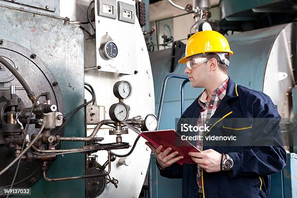 Male Engineer At Work With Clipboard Stock Photo - Download Image Now - Adult, Adults Only, Business