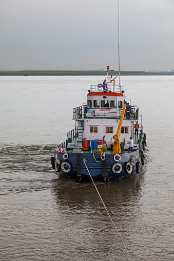 4th April 2023 - Brahmaputra River, india - Tugboat HPT B.R. Ambedkar pulling a cruise ship (unseen) off a sandbank on the Brahmaputra River in Assam, India, where the channels - and sandbanks - change constantly.
