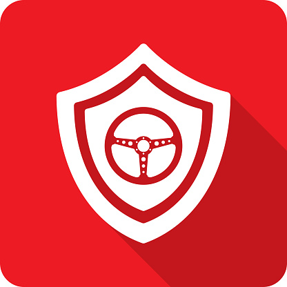Vector illustration of a shield with steering wheel icon against a red background in flat style.