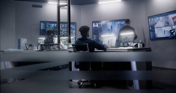 istock Security officer leans on back of chair at work 1491371364