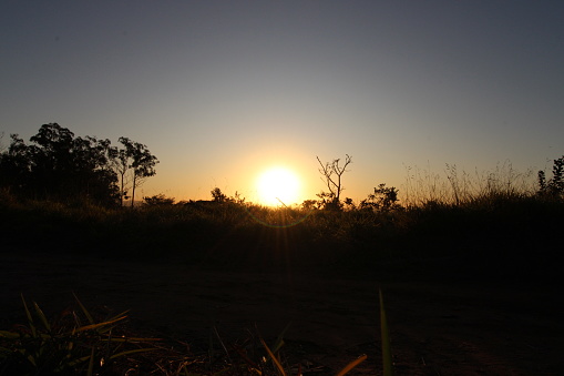 silhouette of a man running at sunset