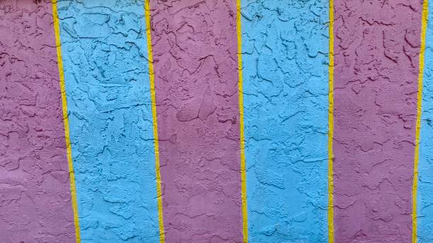 istock Pastel colored pink blue and purple striped wall. 1491385686