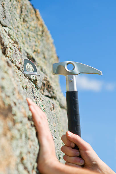 istock Hand of the Climber and hammer 149139246