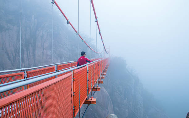 Tourist enjoying to hike passing on bridge in Wolchulsan national park during trip in Yeongam,   South Korea, on  Sunday April 22, 2018