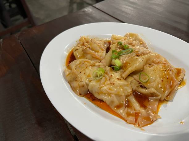 istock Chicken dumplings served with spicy chili oil 1491398908