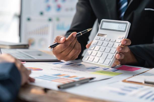 istock Meeting business team advisor about financial graph chart showing results are analyzing and calculating with calculator planning strategy 1491403415