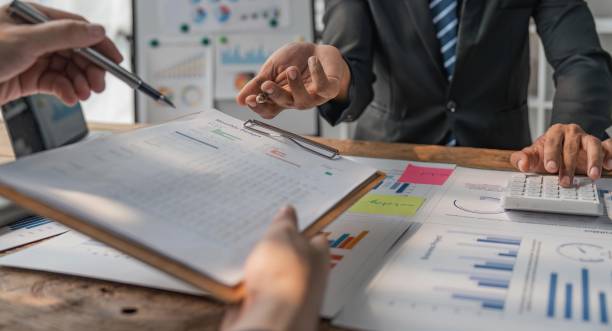 istock Business team working at office with documents on his desk, doing planning analyzing the financial report, business plan investment, finance analysis concept 1491403432