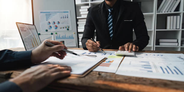 istock Business people discuss investment project working and planning strategy on digital tablet. Business people talking together with tablet at office 1491403446