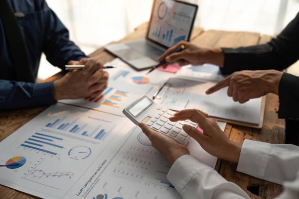 istock Meeting business team advisor about financial graph chart showing results are analyzing and calculating with calculator planning strategy 1491403489