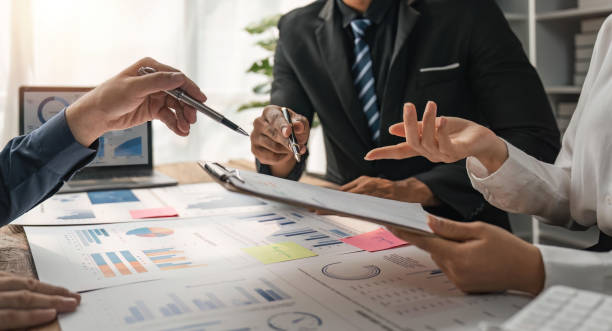 istock Business people discuss investment project working and planning strategy on digital tablet. Business people talking together with tablet at office 1491403530