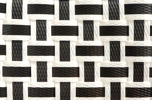 Pattern of black and white plastic woven basket handmade. Texture of handmade plastic weave for background.