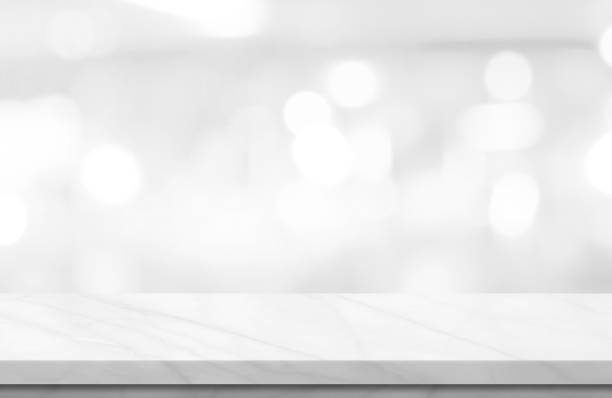Empty white marble over blur background. Empty white marble over blur background, for your photo montage or product display, Space for placing items on the table, product and food display. restaurant table layout stock pictures, royalty-free photos & images