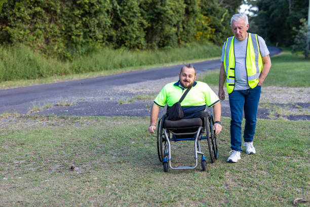 istock Disabled Man in a Wheelchair with a Workmate 1491409295