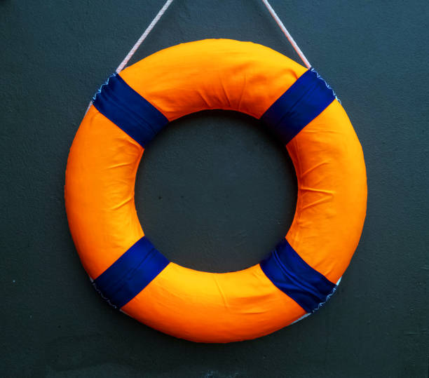 istock Ring rubber orange yellow blue color round circle empty blank symbol sign decoration summer season time swimming pool water wave ocean river sea travel trip tourism safety accident beach emergency 1491409808
