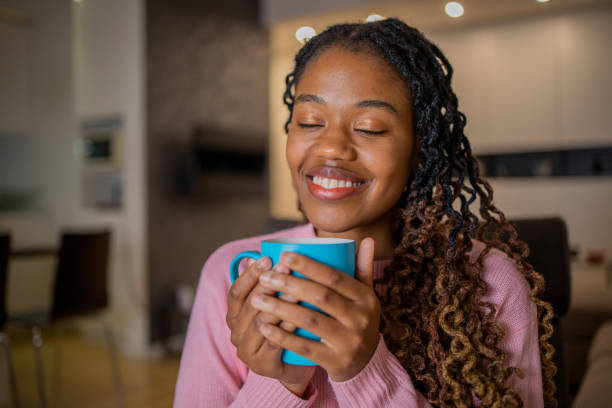istock Woman having coffee and relaxing at home 1491411177