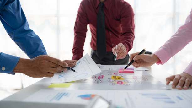 istock Business people meeting explaining the financial graph data and marketing plan. Group of business people at meeting assessment the state of business investment and marketing. 1491416791