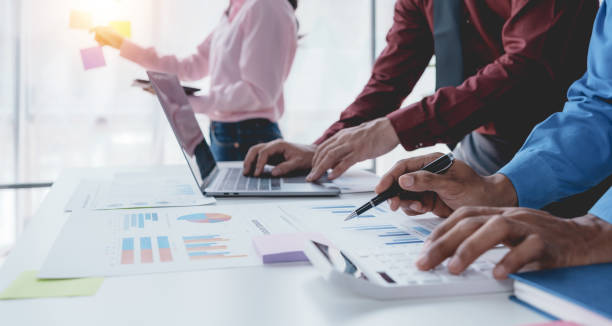 istock Business people meeting explaining the financial graph data and marketing plan. Group of business people at meeting assessment the state of business investment and marketing. 1491416793