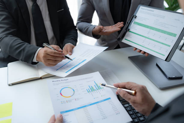istock Business people meeting explaining the financial graph data and marketing plan. Group of business people at meeting assessment the state of business investment and marketing. 1491416840