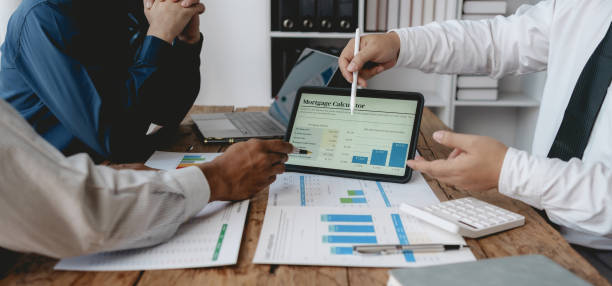 istock Business people meeting explaining the financial graph data and marketing plan. Group of business people at meeting assessment the state of business investment and marketing. 1491416861