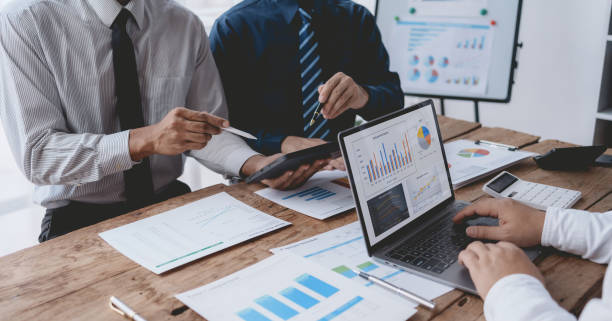 istock Business people meeting explaining the financial graph data and marketing plan. Group of business people at meeting assessment the state of business investment and marketing. 1491416863