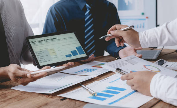 istock Business people meeting explaining the financial graph data and marketing plan. Group of business people at meeting assessment the state of business investment and marketing. 1491416864