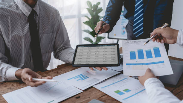 istock Business people meeting explaining the financial graph data and marketing plan. Group of business people at meeting assessment the state of business investment and marketing. 1491416868