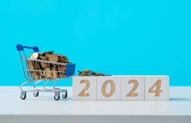 istock Shopping cart and number 2024 on the table 1491417376