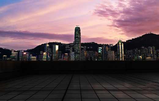 Empty brick floor against hong kong skyline