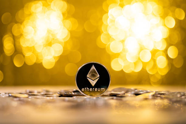 Ethereum cryptocurrency on shiny background Fujian, China - December 23, 2021: Ethereum cryptocurrency on shiny background. ether stock pictures, royalty-free photos & images