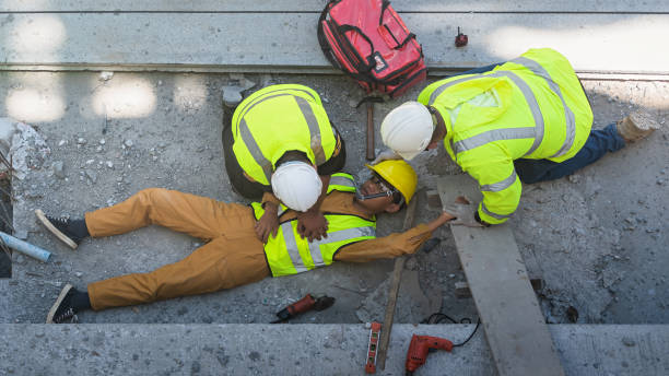 istock A construction worker had an accident at work, fell from a height, seriously injured. First aid to save the lives of construction site workers in an accident. 1491423160