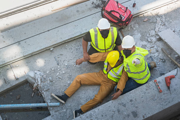 istock A construction worker had an accident at work, fell from a height, seriously injured. First aid to save the lives of construction site workers in an accident. 1491423161