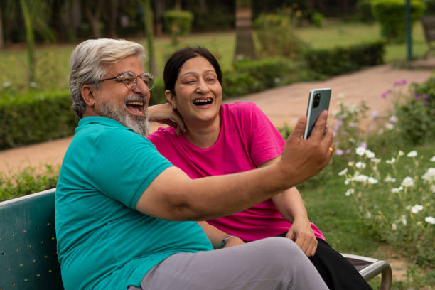 istock Happy senior citizen couple in park 1491423761