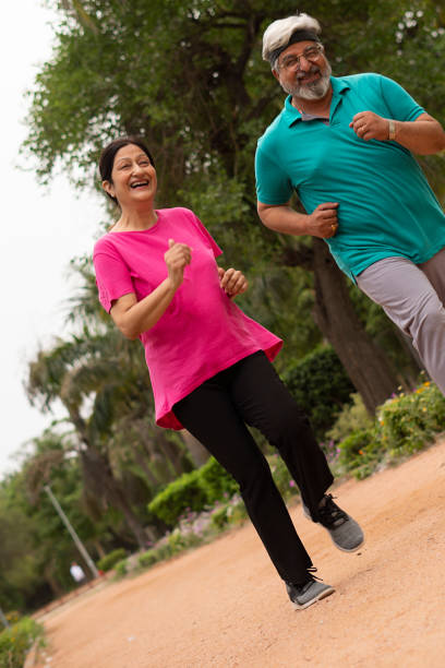 istock Happy senior citizen couple in park 1491423800