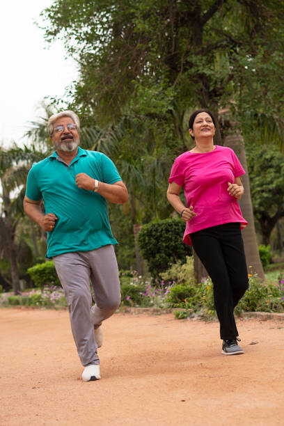 istock Happy senior citizen couple in park 1491423801