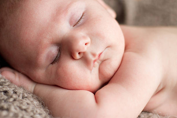 Close up of sleeping baby stock photo