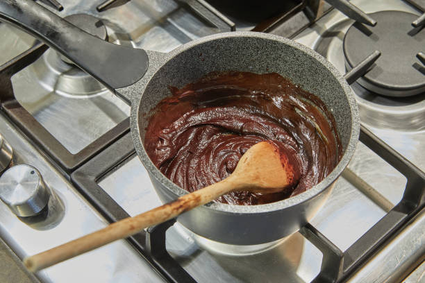 istock Chocolate is cooked in saucepan on gas stove 1491425357