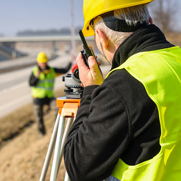istock Geodesist measure land with tacheometer highway 149142625