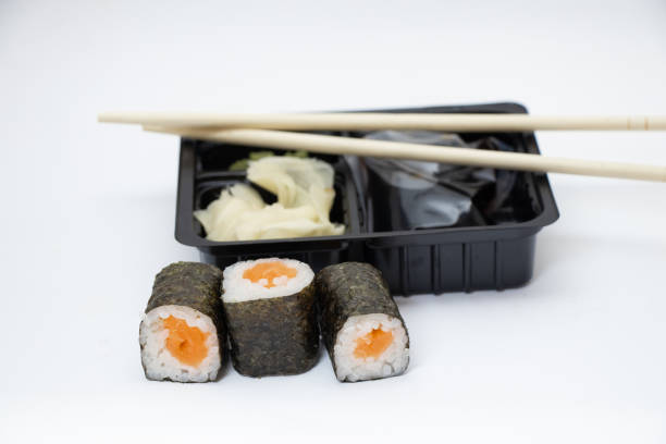 istock sushi with salmon next to plastic food packaging on a white background 1491431403