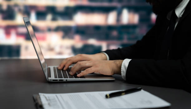 istock Businessman focused on his laptop working on financial report. Equilibrium 1491432844