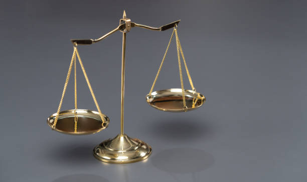 istock Shiny golden scale balance in background as justice symbol. Equilibrium 1491433304