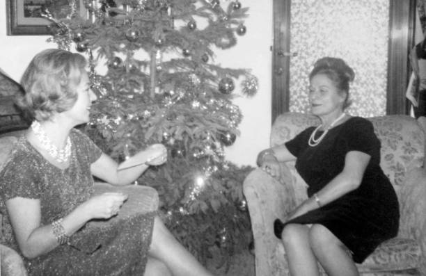 Happy people sitting in the living room in 1956.