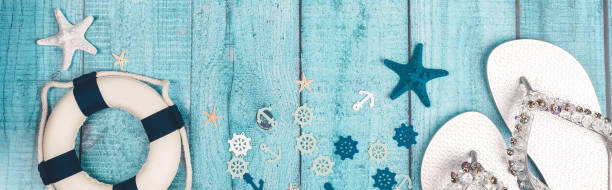 istock Beach accessories on blue board - summer holiday banner. Flat lay. Top view. Copy space 1491436909