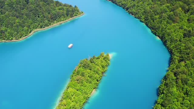 Aerial view of the Kozjak lake with the white boat, Plitvice Lakes National Park, Croatia