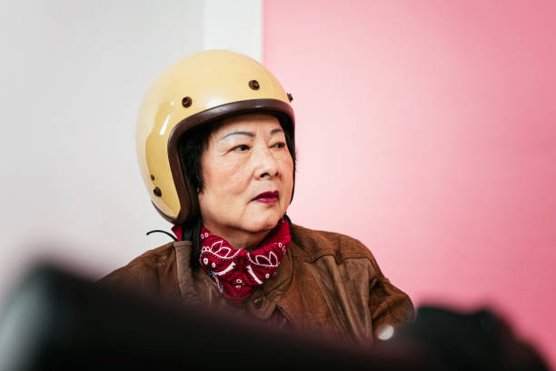 istock Grandmother with motorcycle helmet 1491438685