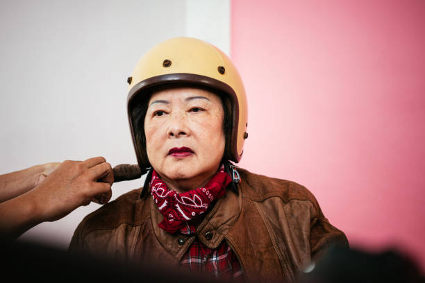 istock Grandmother with motorcycle helmet 1491438694