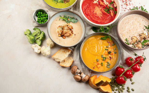 istock Composition with various soups, ingredients and space for text on white background. Healthy food. 1491446889