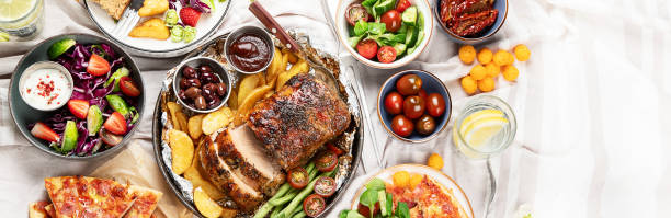 istock Family dinner or lunch. Many dishes on the table. Top view, copy space 1491446922